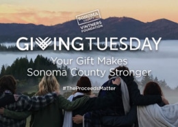 Sonoma County Vintners Foundation Your Gift Makes Sonoma County Stronger #TheProceedsMatter group of people with arms on each other's backs looking over mountains and fog