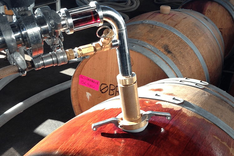 Close up of racking wine in a barrel